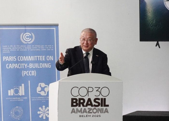 LONGi's Li Zhenguo gives a speech at the COP30 summit.